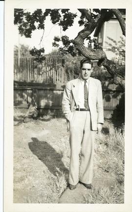 Charles Holland in front yard of 1315 Camosun Street