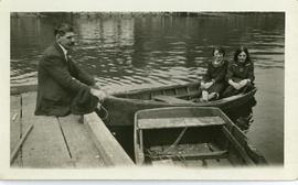 Fred on dock and two girls in boat; Annie Rena on left (?)