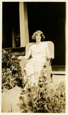 Marjorie Martin sitting outside at Wilkinson Road