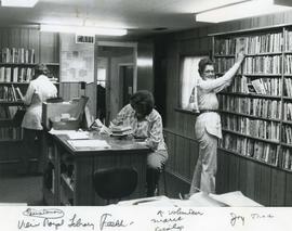 View Royal Library volunteers and patron