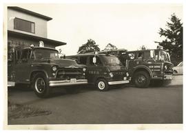 Firetrucks #38, #37, and #39 in front of fire hall